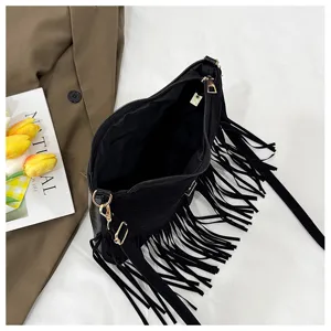 Black fringe shoulder bag, retro crossbody bag with metal zipper and stylish design for women.