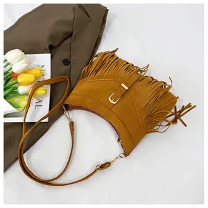 Brown suede fringe shoulder bag for women, retro crossbody bag with metal buckle.