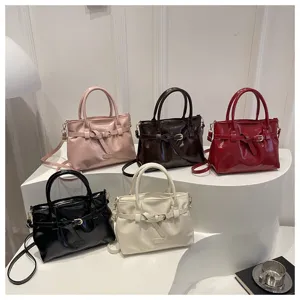 Women's patent leather handbag retro stylish belted shoulder crossbody commuter bag.