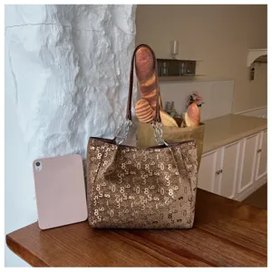 Detailed view of the brown large capacity tote bag featuring digital pattern and chic chain straps.