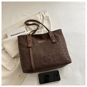 Brown leopard print tote bag detail showing shoulder strap, stylish retro commuting large handbag.