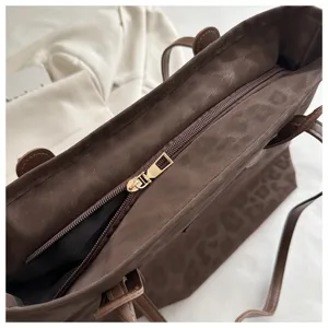 Stylish brown leopard print tote bag for women, retro commuter large shoulder handbag detail.