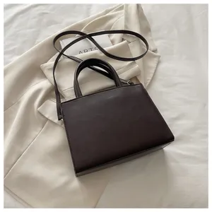 Klassieke donkerbruine PU lederen dameshandtas, elegante gestructureerde vierkante tas.