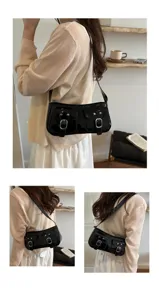 Black patent leather shoulder bag detail, vintage retro baguette handbag with front pocket hardware.