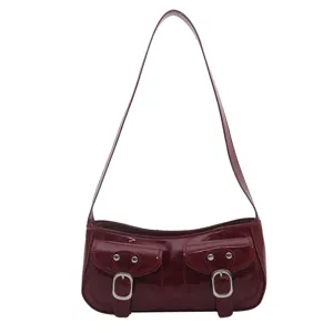Solid color retro women's shoulder bag casual stylish patent leather baguette handbag.