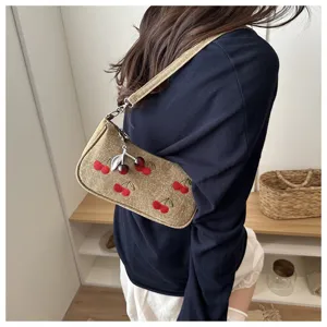 Vintage denim shoulder bag with cute cherry embroidery and pendant, perfect for daily wear.