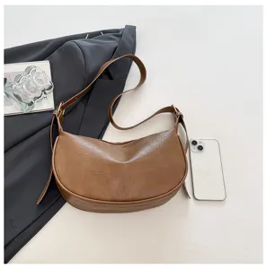 Borsa a tracolla mezzaluna in ecopelle marrone vintage, elegante borsa casual chic.