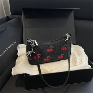 Black denim shoulder bag with red cherry embroidery, vintage chic handbag for women.