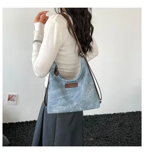 Borsa zaino a tracolla in tela rétro slavata, borsa casual versatile e quotidiana.