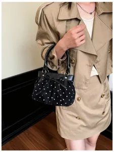 Korean style polka dot pleated handbag with bow detail, stylish and versatile shoulder bag.