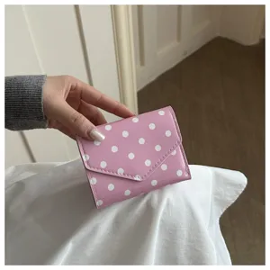 Pink polka dot wallet women's cute short tri-fold purse compact casual daily use accessory.