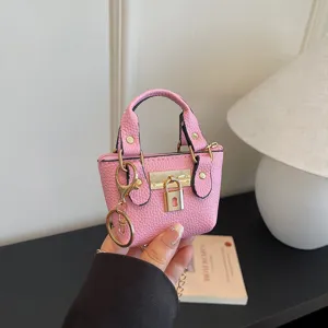 Pequeño bolso de cuero rosa con candado dorado, elegante bolso cruzado para mujeres.