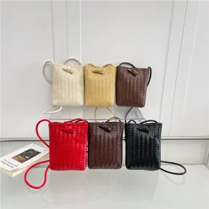 Trendy fashion mini woven shoulder bag for women, versatile leather crossbody pouch.