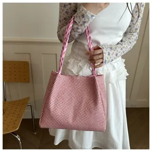 Woven shoulder bag for women, stylish pink tote bag for daily commute and casual use.