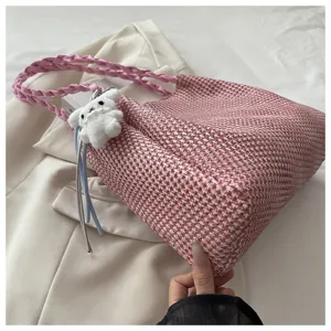 Pink woven tote shoulder bag for women, casual daily handbag with cute plush puppy charm.