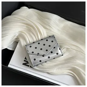 Polka dot small wallet detail shot showcasing the sleek silver design and compact structure.