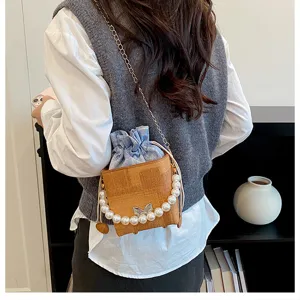 Stylish casual bucket bag with pearl handle and chain strap, trendy summer crossbody bag for women