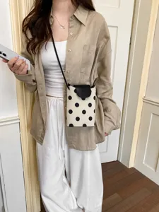 Chic sac bandoulière noir et blanc à pois pour femme, très élégant petit sac d'été.