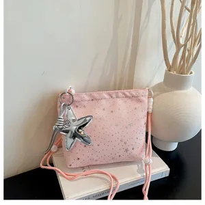Pink crossbody bag with star pattern and silver star charm for women daily fashion.