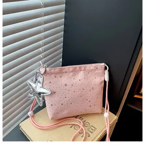 Pink canvas crossbody bag featuring cute star prints and a shiny starfish pendant design.