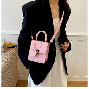 Roze PU lederen mini handtas voor dames, veelzijdige schoudertas met handvat.