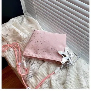 Pink crossbody bag with silver star print and cute star pendant for everyday use.