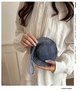 Detailed view of creative denim fisherman hat shape coin purse, mini bag charm with lanyard.