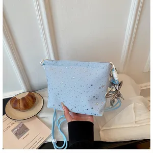 Light blue crossbody bag with silver star studs and cute star charm for daily casual wear.