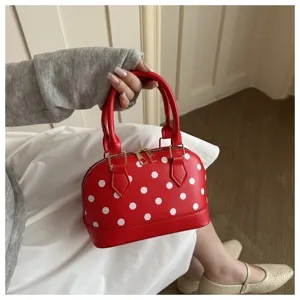 Red polka dot dome handbag stylish PU leather shoulder bag for women daily fashion use.