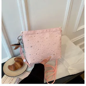 Pink star canvas crossbody bag, cute star print shoulder bag with adjustable strap and charm.
