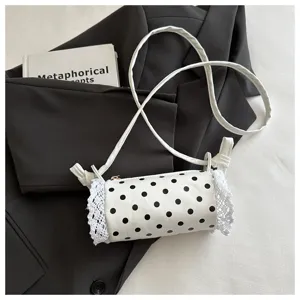 Graziosa borsa a tracolla cilindrica a pois con delicato bordo in pizzo bianco per bambine e ragazze.