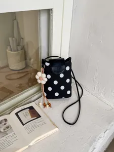 Petit sac bandoulière à pois noir et blanc avec pendentif fleur mignon pour femmes élégant.