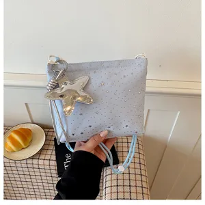 Blue star pattern crossbody bag with large metallic star keychain for women daily fashion style