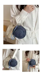 Denim fisherman hat shaped coin purse detail showing unique creative mini bag pendant for earphones.