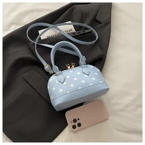 Light blue polka dot shell handbag, elegant women crossbody purse with top handle.