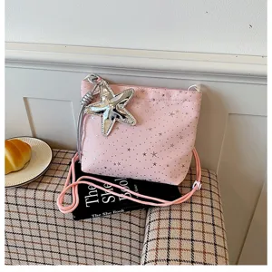 Pink crossbody bag with silver star print and star pendant detail, stylish daily shoulder bag.
