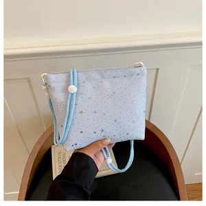 Light blue canvas crossbody bag with cute star prints, adjustable strap, daily casual style.