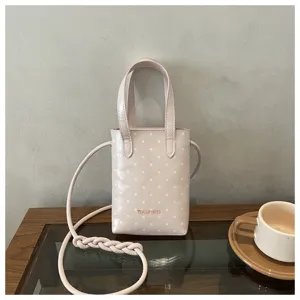 Bolso cruzado rosa con lunares para mujer, cartera pequeña y bonita con asa y correa larga.