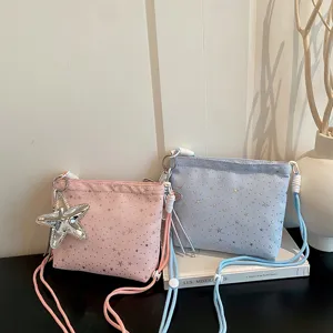 Stylish women star pattern crossbody bag with star pendant and rope strap for daily use.