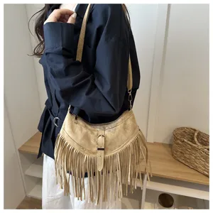 Western retro style suede fringe hobo shoulder bag with wide adjustable strap detail.