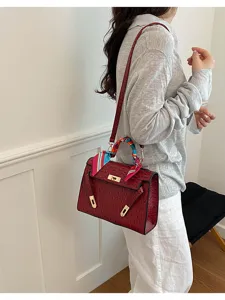 Chic retro women handbag detail view, elegant textured crossbody bag design for summer fashion.