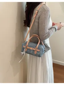 Stylish denim handbag for women, retro shoulder and crossbody bag with chic star pendant.