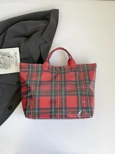 Stylish red plaid tote bag for women, large capacity waterproof casual handbag for daily commute.