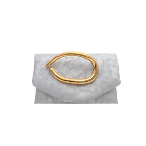 Elegant silver clutch bag with unique gold irregular metal handle, chic and modern style.