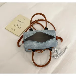 Denim boston handbag with brown leather handles and strap, retro casual crossbody bag.
