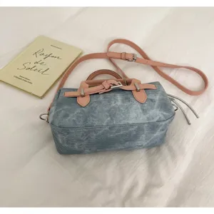 Chic denim mini boston bag with pink leather straps, vintage style top handle crossbody bag.