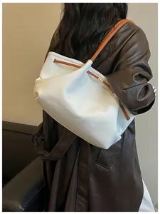 White leather shoulder bag, stylish hobo handbag with brown straps, chic French design for daily use.