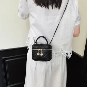 Black quilted chain crossbody bag for women, chic mini shoulder handbag with gold hardware.