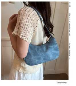 Retro blue shoulder underarm bag for women, minimalist daily commuting chic handbag style.