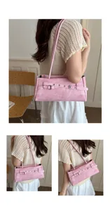 Detail view of the pink denim shoulder bag showing the stylish belt buckle and strap design.